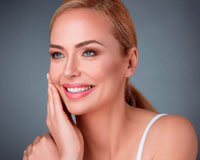 Picture of a smiling woman happy with her facelift and necklift in Costa Rica